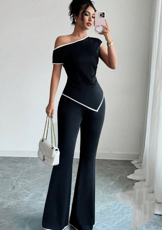 Conjunto pantalon negro y top negra con filos blancos talla standar CR16